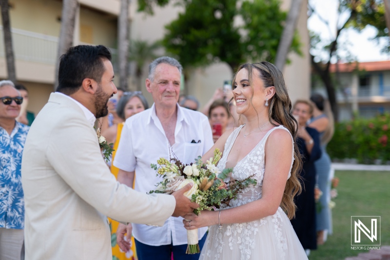 Joyful couple exchanging vows during a romantic outdoor wedding ceremony in tropical surroundings with family and friends in attendance, capturing beautiful moments of love and celebration