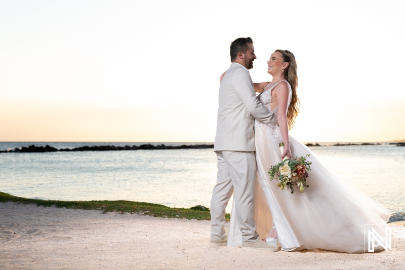 Couple celebrating their beach wedding at sunset in tropical paradise with serene ocean view and romantic ambiance