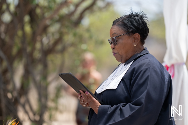Celebration of love unfolds during a wedding ceremony at Fort Beekenburg in Curacao under the bright sun
