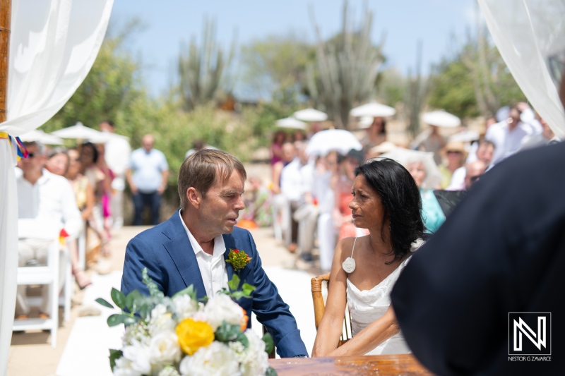 Memorable wedding ceremony at Fort Beekenburg overlooking the stunning scenery of Curacao with an intimate gathering of family and friends
