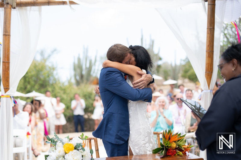 Love celebrated with a heartfelt embrace during a wedding ceremony at Fort Beekenburg in Curacao