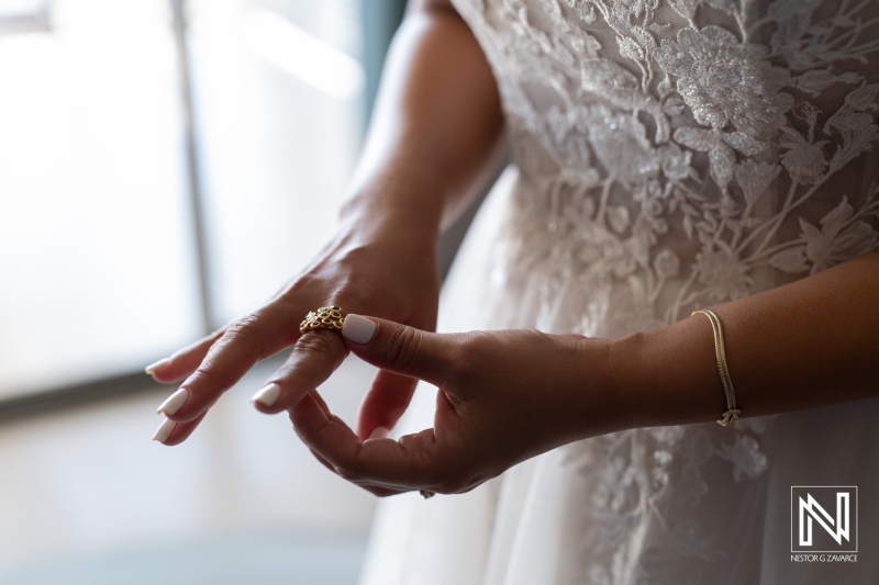 Bridal moments captured in Curacao as the bride prepares for a romantic wedding ceremony filled with love and celebration