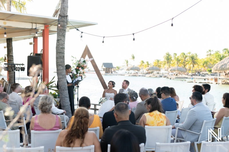 Wedding ceremony in Curacao by the beach with guests celebrating the special occasion