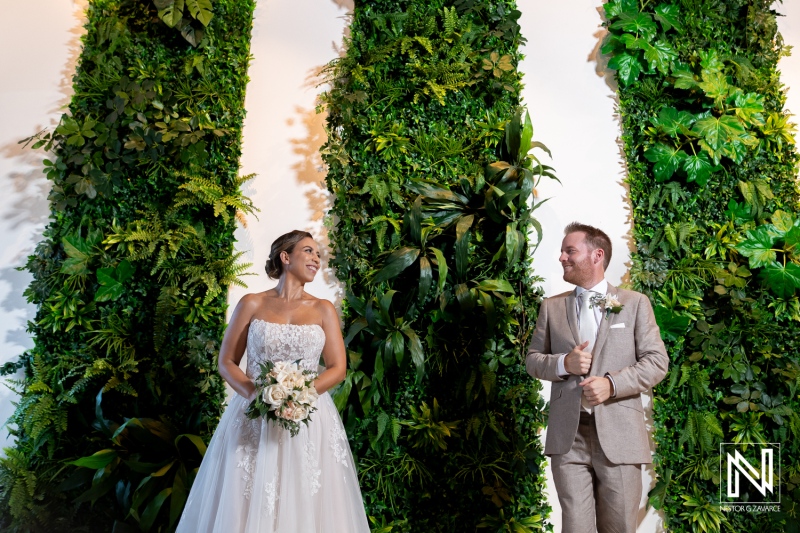 Wedding celebration in Curacao featuring a joyful couple by lush greenery