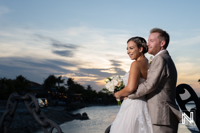 Couple celebrating their wedding in Curacao with a beautiful sunset backdrop