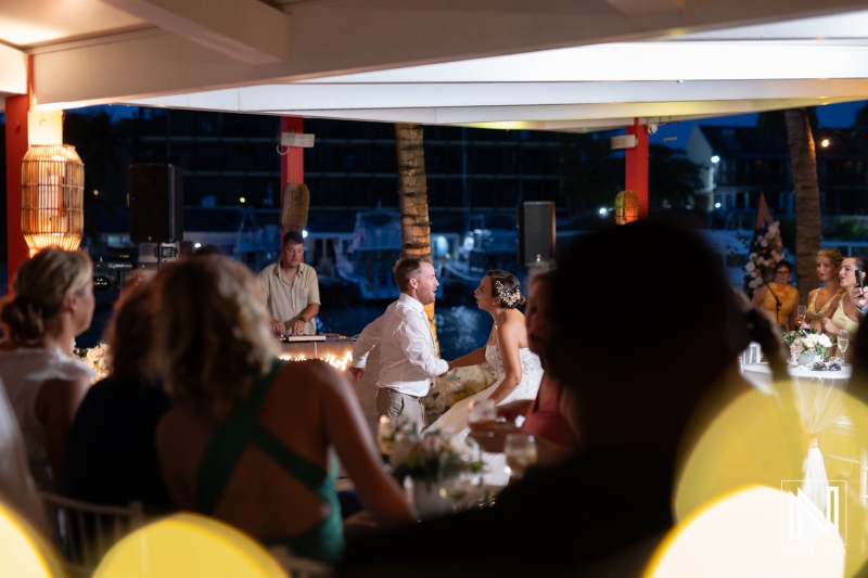 Beautiful wedding celebration in Curacao with joyful couple enjoying their first dance surrounded by friends and family