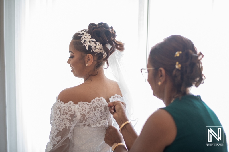 Bride getting into attire